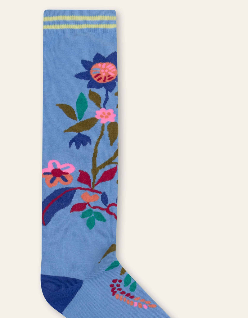 Blue Oilily socks with flowers. This way, you’ll love putting the flowers outside.